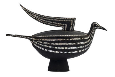 Black wooden food bowl, frigate bird shape. Solomon Islands, 1960s. Mother-of-pearl inlay.